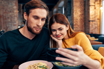 young couple having dinner in restaurant