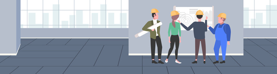 Obraz premium construction workers studying blueprint engineers team discussing new building project during meeting industrial technicians teamwork concept modern apartment interior full length horizontal