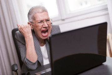 Fototapeta premium Furious and enraged old business lady