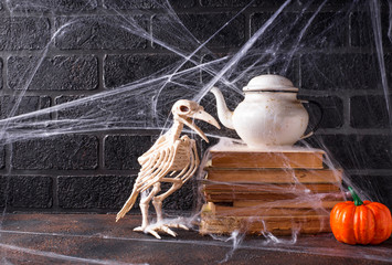 Halloween background with bird skeleton