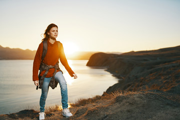 woman running on the beach at sunset