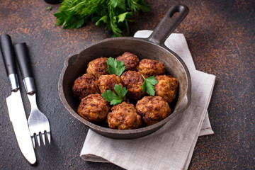 Homemade beef meatballs in frypan