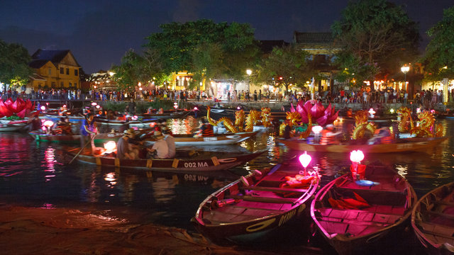 A Bustling Scene: Night Boat Ride at Ancient Town of Hoi An, Vietnam 