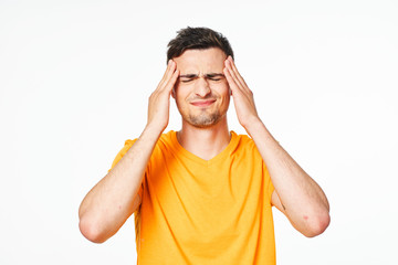 Fototapeta premium young man with hands on his head