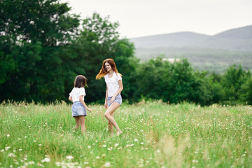 mother and daughter in the field