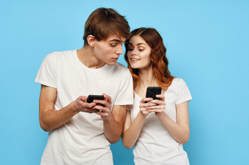 young couple taking picture of themselves with mobile phone