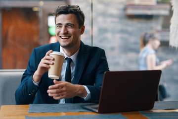 man in cafe with digital tablet