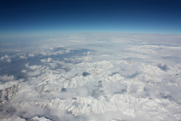 Flying over the Himalayas - a beautiful view from the window of an airplane