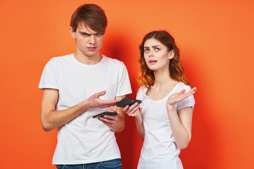 young couple in t-shirts studio