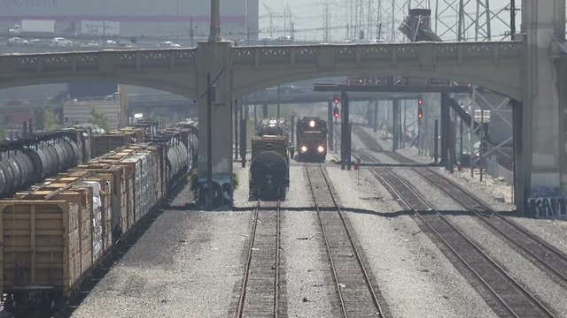 A freight train approaching in the railroad yards of downtown Los Angeles
