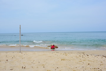 White waves at the beach at the seaside of the island