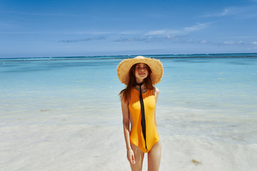 Fototapeta na wymiar young woman in bikini on the beach