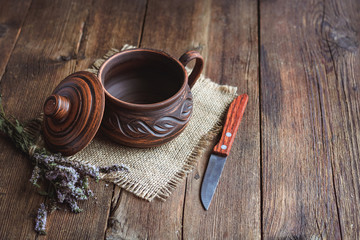 clay cookware on the old wooden boards.
