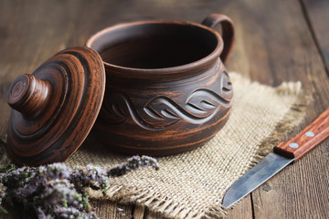 clay cookware on the old wooden boards.