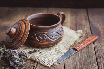 clay cookware on the old wooden boards.