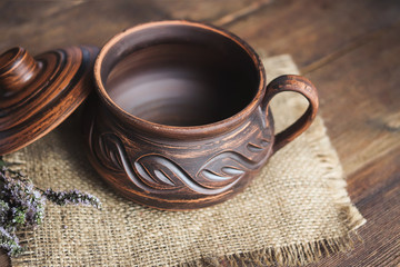 clay cookware on the old wooden boards.