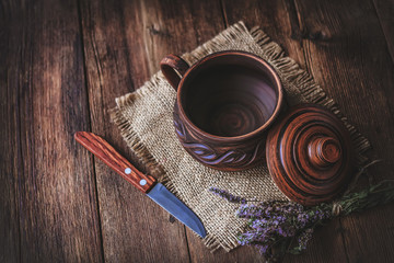 clay cookware on the old wooden boards.