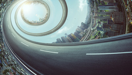 Abstract rotating highway with distorting city skyline .The concept of abstract urban background...