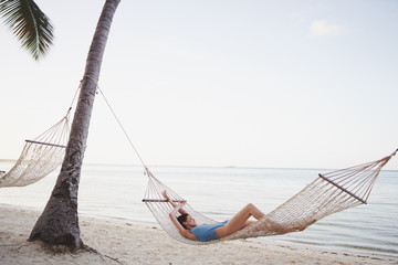 woman on hammock on the beach