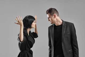 man and woman fighting over white background