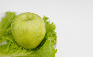green apple on white background, copy space. healthy lifestyle