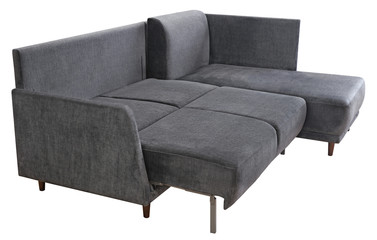 Corner sofa isolated on white background. Including clipping path. The sofa is laid out for sleep