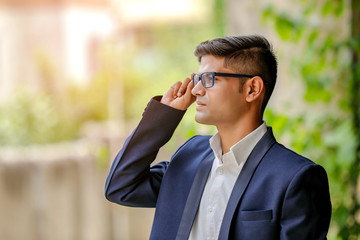yong indian business man in eyeglasses