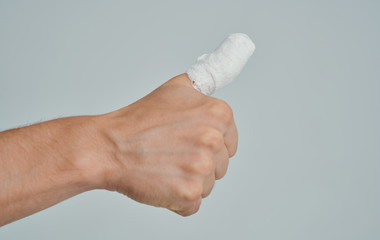 hand with bandage isolated on white