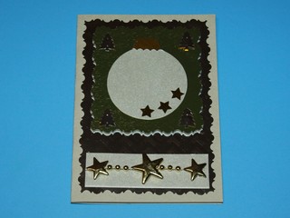 new year greeting card made of colored paper gold leaf, gray christmas ball and gold stars