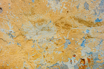 Texture of a concrete wall with cracks and scratches which can be used as a background