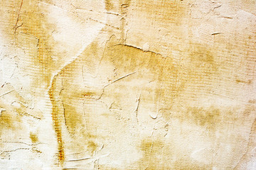 Naklejka premium Tekstura betonowej ściany z pęknięciami i zadrapaniami, które mogą służyć jako tło