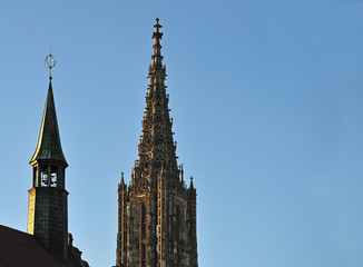 Fototapeta na wymiar steeple of Ulm Minster and turret on town hall