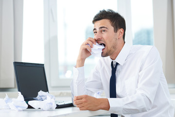 businessman talking on phone in his office