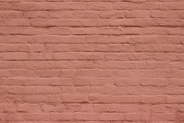 Fototapeta premium Antique old shabby chic brick wall texture background, bearing several layers of reddish brown paint