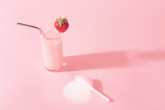 Two strawberry smoothies with collagen powder or protein.