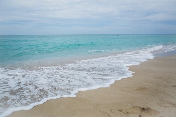 Fototapeta na wymiar Wave of the Sea on a Beach