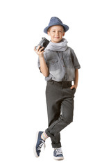 Cute little photographer with professional camera on white background