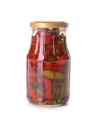 Jar with canned chili pepper on white background