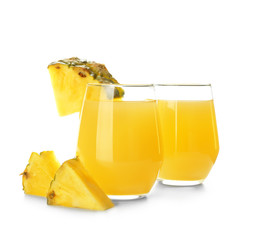 Glasses of tasty pineapple juice on white background