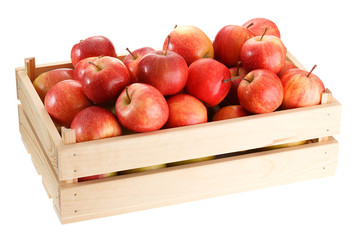 Crop of ripe red apples in a wooden crate. Isolated on white background.