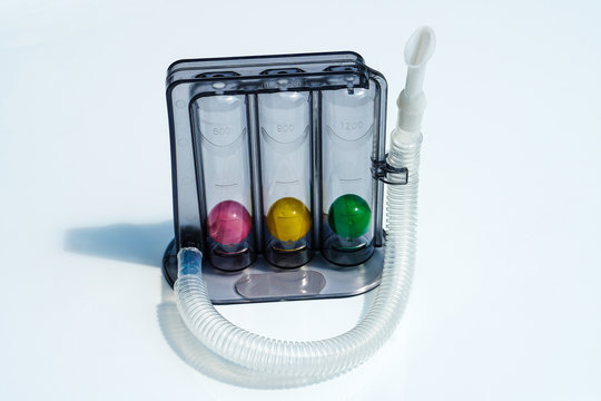 Triflow incentive spirometer for inhalation exercise on white background, Triball 