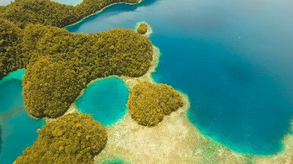 aerial seascapel Islands with bay and lagoon, beach. Tropical landscape hill, clouds and mountains rocks with rainforest. Azure water of lagoon. Shore Landscape Bay. Aerial video.Seascape. Travel