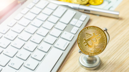 The bitcoin currency on office table for business content..
