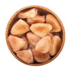 heap of cacao beans in wooden cup isolated on white background. top view