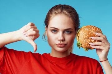 woman with hamburger on white background