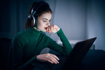 young woman listening to music with headphones