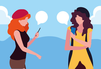 two women using smartphone talking