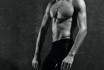 Fototapeta na wymiar muscular man on black background