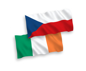 National vector fabric wave flags of Ireland and Czech Republic isolated on white background. 1 to 2 proportion.