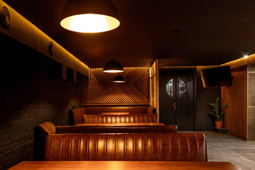The interior of a nightclub, a pub in dark colors.